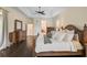 Main bedroom with king-size bed, dresser, and walk-in closet at 654 Trenton Way, Osprey, FL 34229