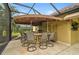 Covered outdoor bar with seating for six at 654 Trenton Way, Osprey, FL 34229