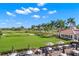 Outdoor patio with tables, umbrellas, and fire pit at 654 Trenton Way, Osprey, FL 34229