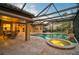 Inviting pool and spa with covered patio and dining area at 654 Trenton Way, Osprey, FL 34229