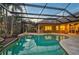 Relaxing pool area with covered patio and outdoor seating at 654 Trenton Way, Osprey, FL 34229