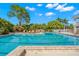 Resort-style pool with lounge chairs and surrounding landscaping at 654 Trenton Way, Osprey, FL 34229