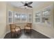 Charming sitting area with two armchairs and a large window overlooking the backyard at 654 Trenton Way, Osprey, FL 34229