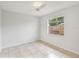 Simple bedroom with tile flooring and a window with blinds at 6770 Mauna Loa Blvd, Sarasota, FL 34241