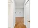 Hallway with light wood laminate flooring at 6770 Mauna Loa Blvd, Sarasota, FL 34241