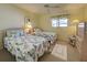 Bright bedroom with twin beds, nightstands, and a dresser at 6800 Placida Rd # 2017, Englewood, FL 34224