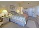 Bright bedroom with queen bed and ensuite access at 6800 Placida Rd # 2017, Englewood, FL 34224