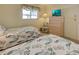 Bedroom with twin beds, dresser and window at 6800 Placida Rd # 2017, Englewood, FL 34224