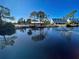 Scenic pond view with community buildings at 6800 Placida Rd # 2017, Englewood, FL 34224