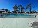 Sparkling community pool with lounge chairs at 6800 Placida Rd # 2017, Englewood, FL 34224