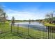 Scenic backyard view of a lake and golf course at 6919 Winners Cir, Lakewood Ranch, FL 34202