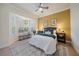 Bright bedroom with a cozy bed, window bench, and decorative accents at 6919 Winners Cir, Lakewood Ranch, FL 34202