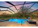 Stunning pool and spa at sunset with screened enclosure at 6919 Winners Cir, Lakewood Ranch, FL 34202