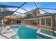 Expansive pool and spa with covered patio and fire feature at 6919 Winners Cir, Lakewood Ranch, FL 34202