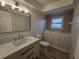 Updated bathroom with walk-in shower and modern vanity at 7 Oakland Hills Pl, Rotonda West, FL 33947