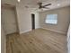 Well-lit bedroom with wood-look floors and ceiling fan at 7 Oakland Hills Pl, Rotonda West, FL 33947