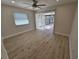 Bedroom with sliding doors to patio and wood-look floors at 7 Oakland Hills Pl, Rotonda West, FL 33947