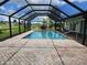 Screened pool and patio area with spacious backyard at 7 Oakland Hills Pl, Rotonda West, FL 33947