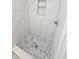 Modern shower with pebble stone floor and niche at 7 Oakland Hills Pl, Rotonda West, FL 33947