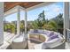 Relaxing outdoor balcony with wicker furniture and city views at 7007 Point Of Rocks Rd, Sarasota, FL 34242