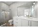 Modern bathroom with walk-in shower and white vanity at 7007 Point Of Rocks Rd, Sarasota, FL 34242