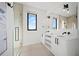 Elegant bathroom with double vanity and large mirror at 7007 Point Of Rocks Rd, Sarasota, FL 34242