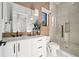 Contemporary bathroom with floating vanity, glass shower, and wood-look tile at 7007 Point Of Rocks Rd, Sarasota, FL 34242