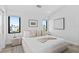 Bright bedroom with king-size bed and large windows at 7007 Point Of Rocks Rd, Sarasota, FL 34242