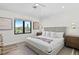 Spacious bedroom with king-size bed and wood floors at 7007 Point Of Rocks Rd, Sarasota, FL 34242