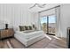 Bedroom with king-size bed and sliding glass door at 7007 Point Of Rocks Rd, Sarasota, FL 34242