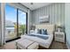 Spacious bedroom with large window, comfy bed, and serene view at 7007 Point Of Rocks Rd, Sarasota, FL 34242