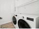 Clean laundry room with side-by-side washer and dryer set at 7007 Point Of Rocks Rd, Sarasota, FL 34242