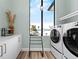 Bright laundry room, featuring washer, dryer, and ample storage at 7007 Point Of Rocks Rd, Sarasota, FL 34242