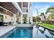 Relaxing pool area with patio furniture and a modern design at 7007 Point Of Rocks Rd, Sarasota, FL 34242