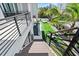 Modern staircase leading to a backyard oasis with a pool and lawn at 7007 Point Of Rocks Rd, Sarasota, FL 34242