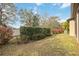 Landscaped backyard with lush greenery and a hedge at 715 116Th Ne Ct, Bradenton, FL 34212