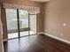 Dining room with hardwood floors and sliding doors to patio at 715 116Th Ne Ct, Bradenton, FL 34212