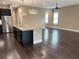 Kitchen with island, stainless steel appliances, and hardwood floors at 715 116Th Ne Ct, Bradenton, FL 34212