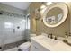 Bathroom with walk-in shower, modern vanity, and elegant decor at 7203 41St E Ct, Sarasota, FL 34243