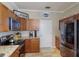 Kitchen boasts granite countertops, stainless steel appliances, and wood cabinets at 7203 41St E Ct, Sarasota, FL 34243