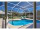 Screened pool area with lounge chairs and backyard access at 7203 41St E Ct, Sarasota, FL 34243