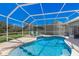 Inviting screened pool area with lounge chairs, ideal for relaxation at 7203 41St E Ct, Sarasota, FL 34243