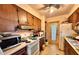 Small kitchen with wood cabinets and appliances at 729 41St St, Sarasota, FL 34234