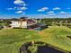 Aerial view of two-story house with pool and lush landscaping at 7315 Bianco Duck Ct, Sarasota, FL 34240