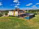 Two-story house with pool and screened enclosure, beautiful landscaping at 7315 Bianco Duck Ct, Sarasota, FL 34240