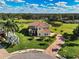 Two-story house with tile roof and landscaped yard at 7315 Bianco Duck Ct, Sarasota, FL 34240