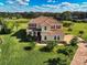 Two-story house with a red door and lush landscaping at 7315 Bianco Duck Ct, Sarasota, FL 34240