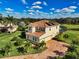 Two-story house with pool and solar panels on the roof at 7315 Bianco Duck Ct, Sarasota, FL 34240