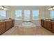 Luxurious bathroom with a large soaking tub and double vanity at 7315 Bianco Duck Ct, Sarasota, FL 34240