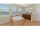 Bathroom with a large soaking tub and double vanity at 7315 Bianco Duck Ct, Sarasota, FL 34240